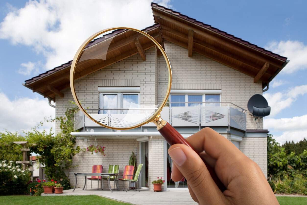 magnifying-glass-over-house